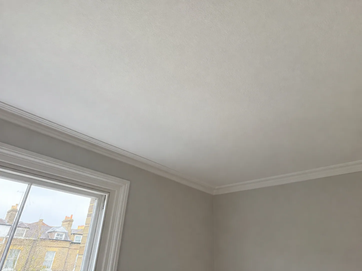 AI-generated illustration: Plain ceiling and cornice in a London room