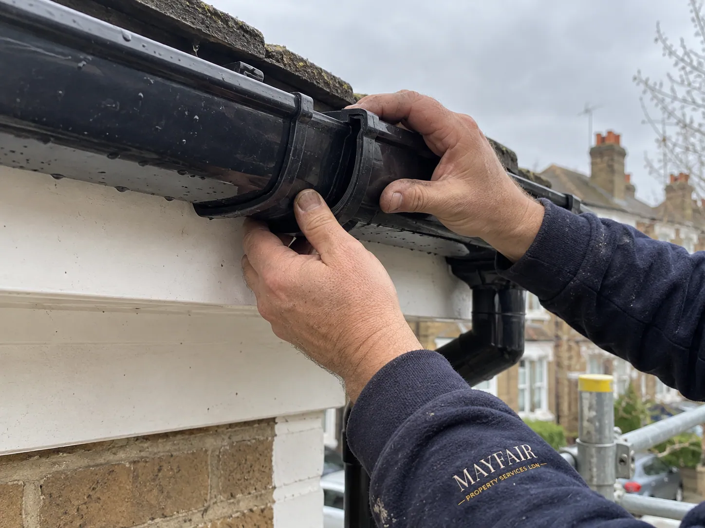 AI-generated illustration: Close-up of a gutter joint being checked