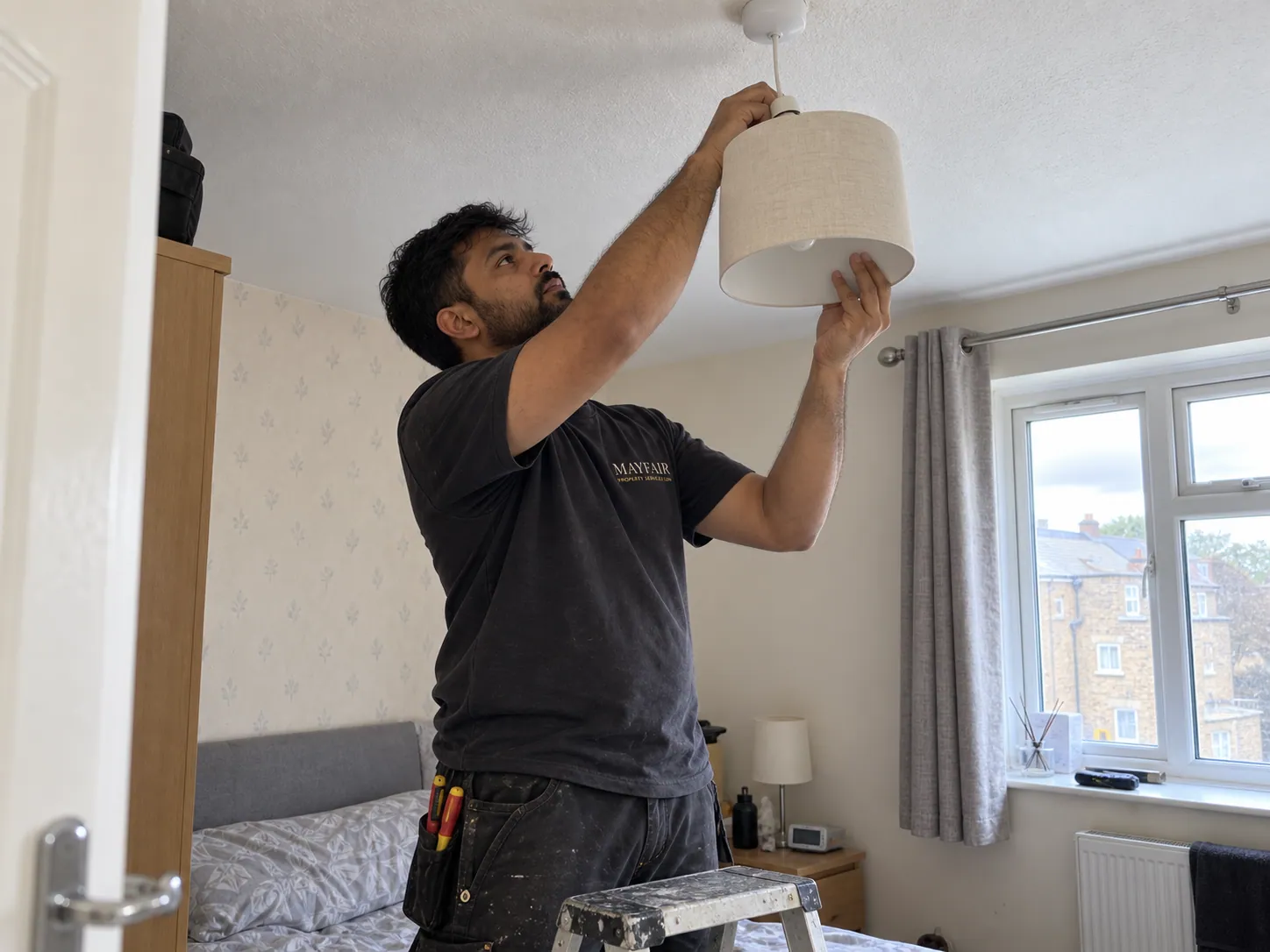 AI-generated illustration: Electrician working on a ceiling light fitting